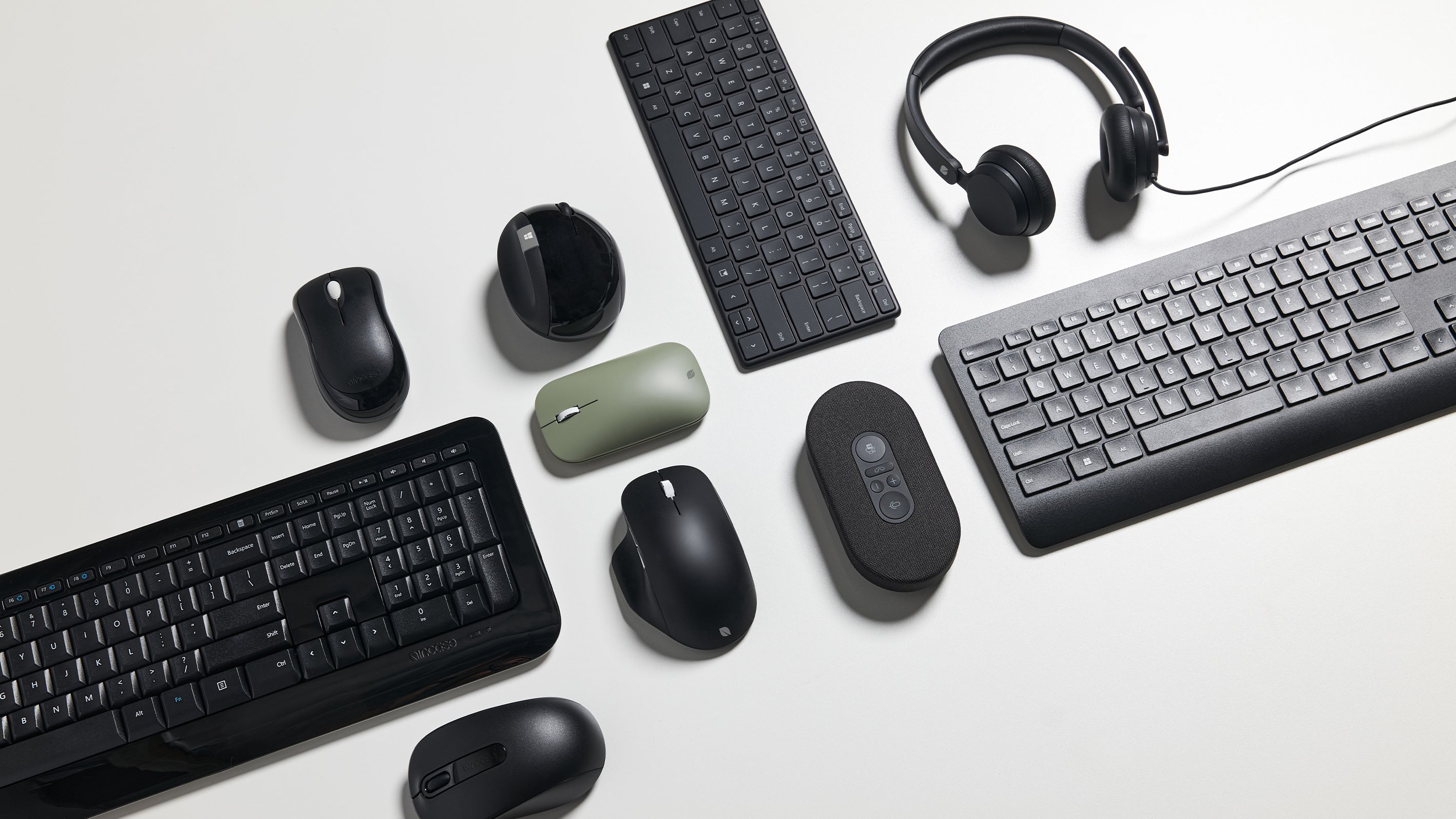 multiple Microsoft accessories laying flat in a group photo